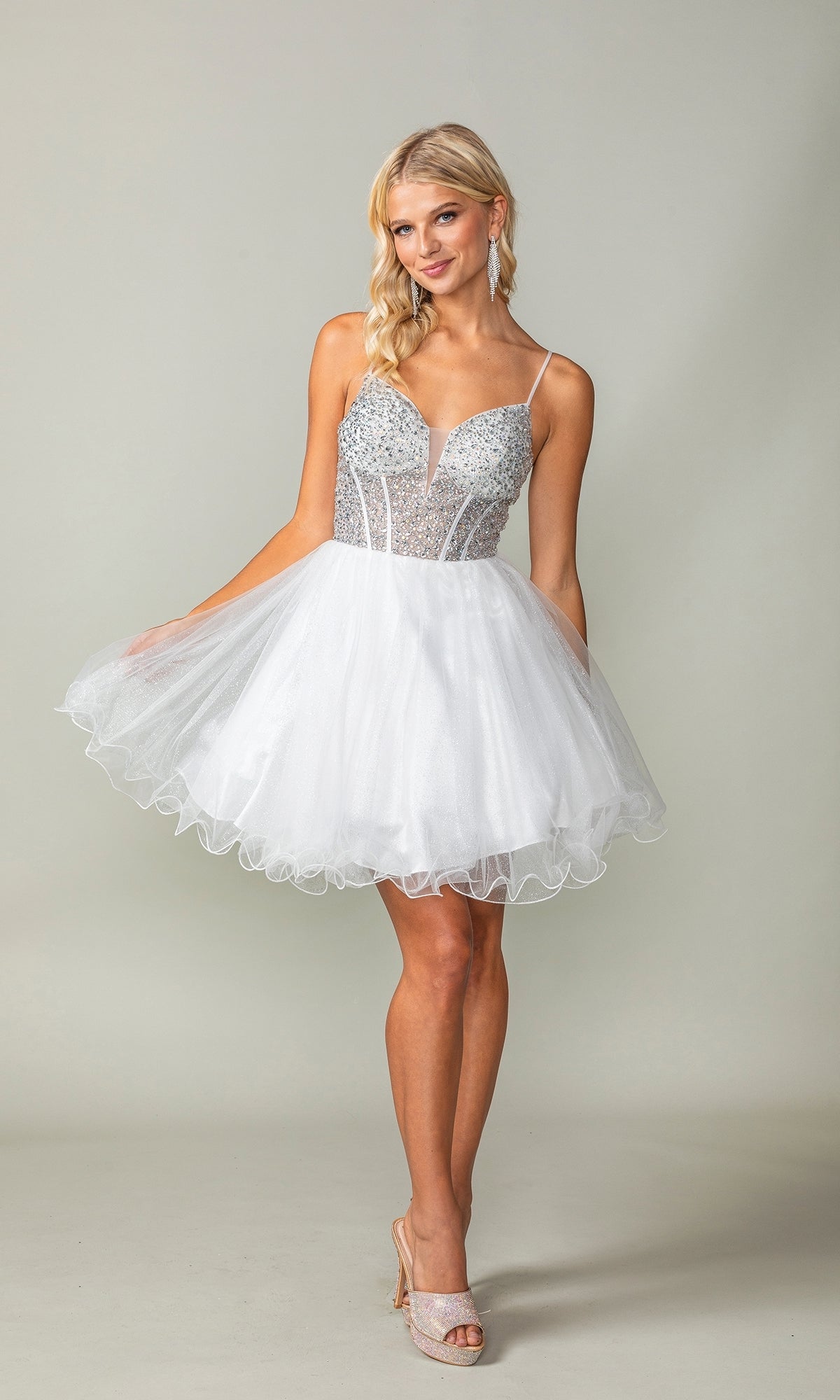 A woman models the Beaded Corset Short A-Line Homecoming Dress 3353, featuring a beaded corset-style bodice and thin straps, paired with nude heels against a plain light background.